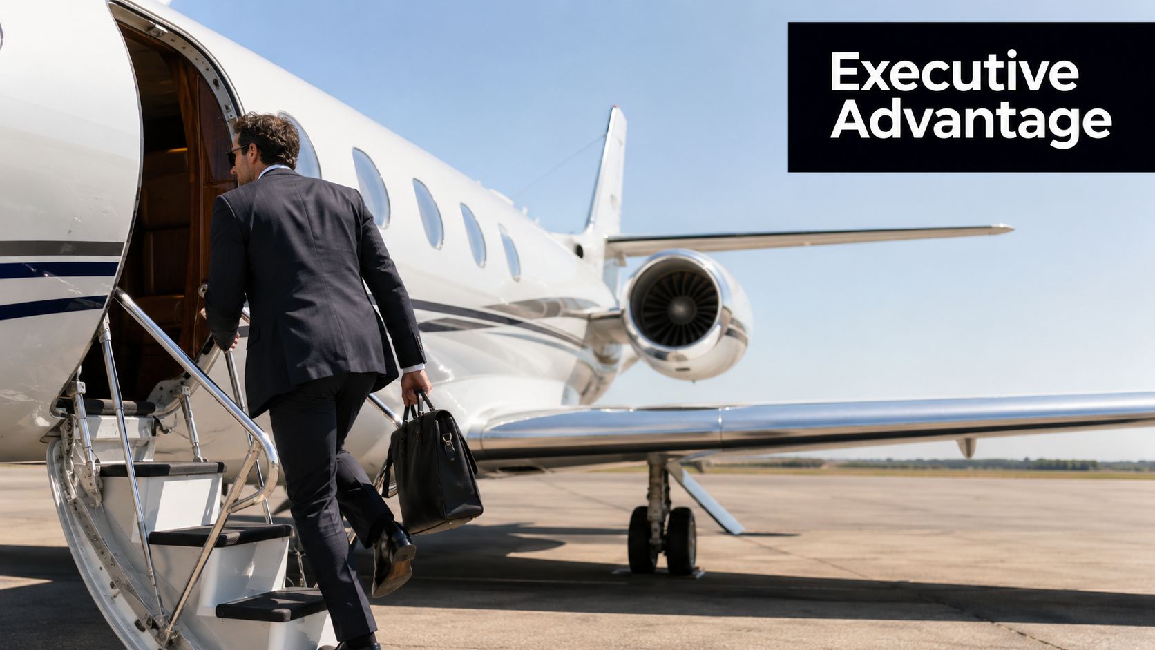 A businessman in a suit boards a private jet plane on a sunny airport tarmac.